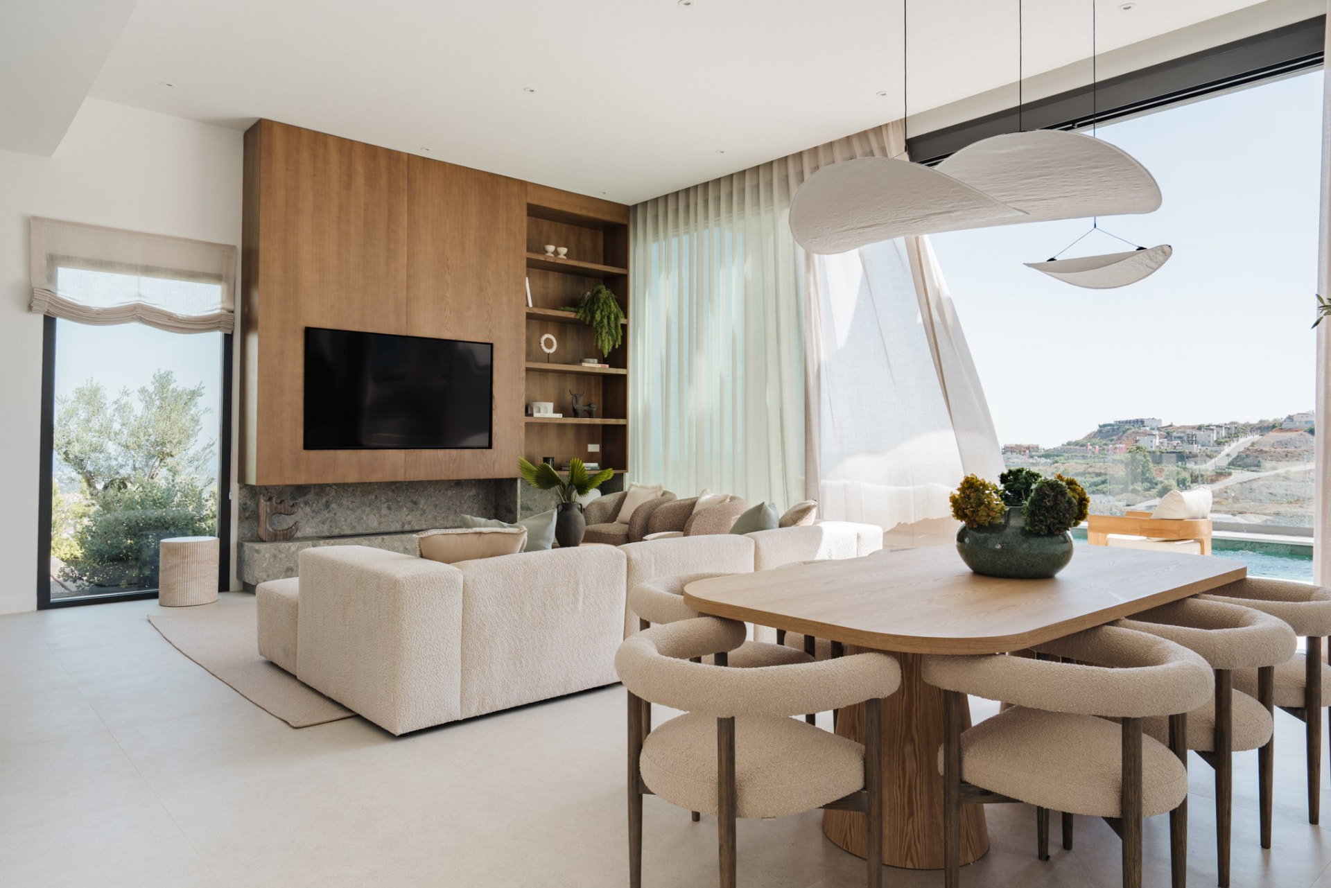 Living and dining room opening to the pool terrace