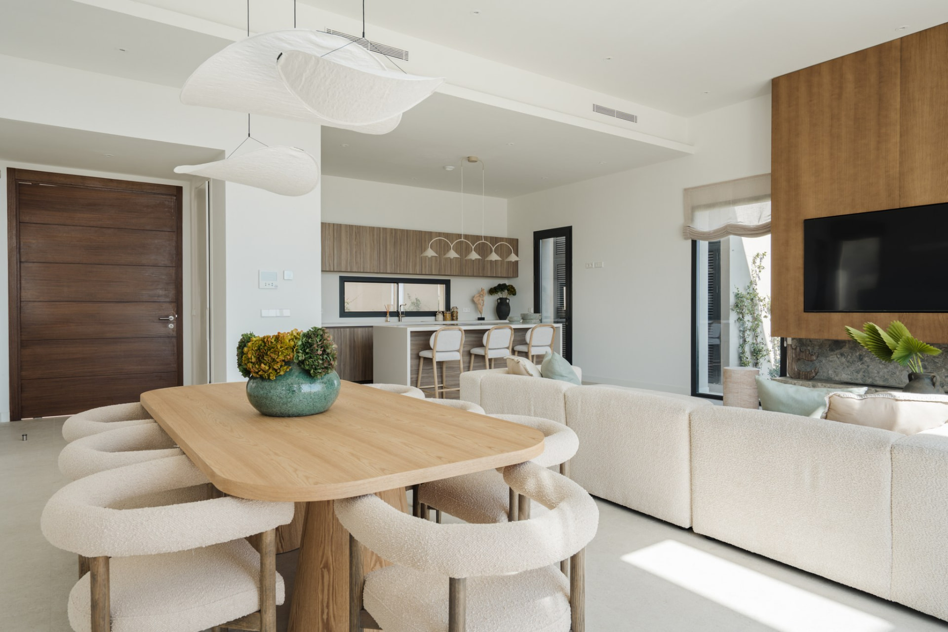 Dining table with entrance hall and kitchen beyond