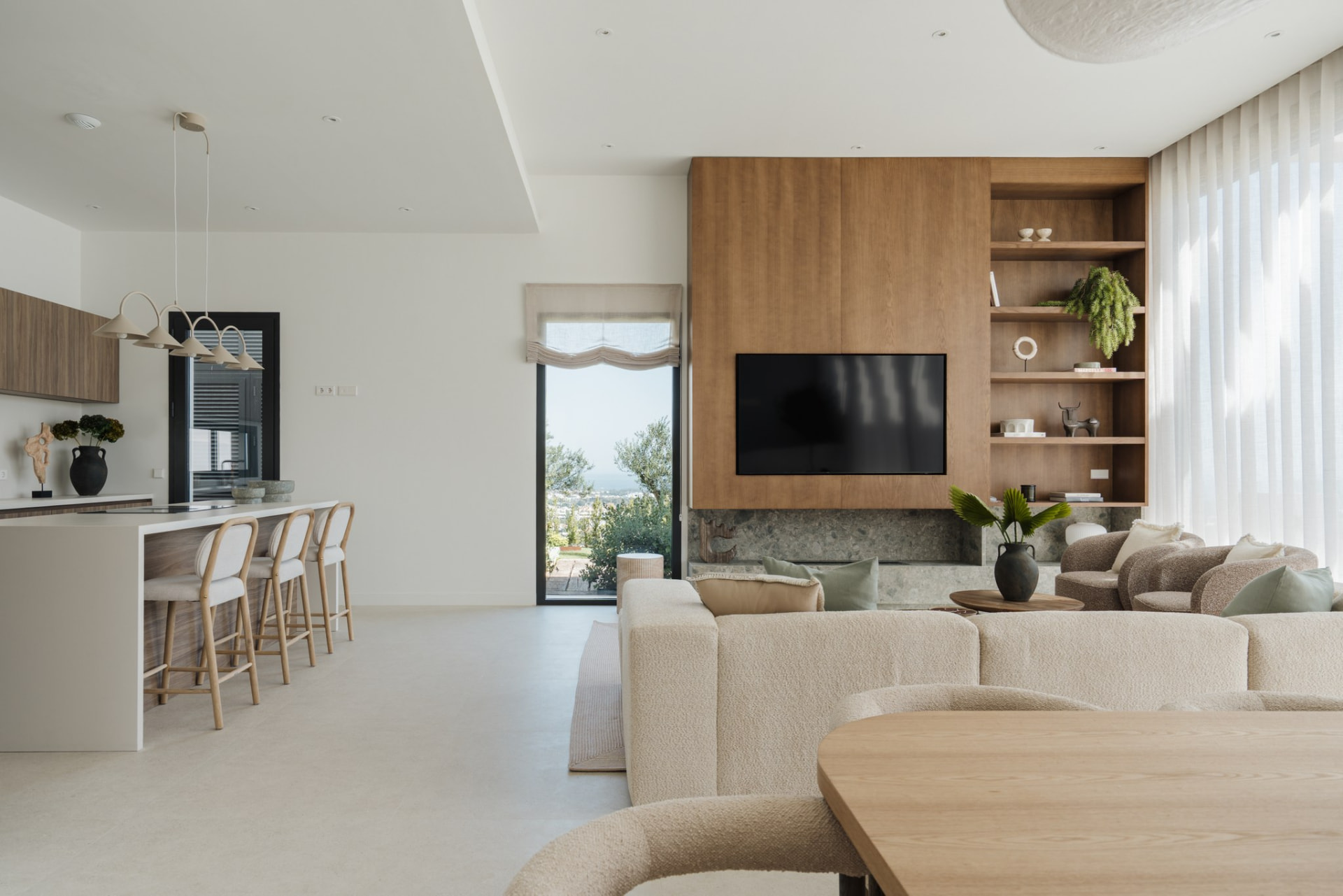 Kitchen bar and living area with sea views beyond
